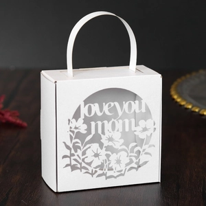 Detail of white laser-cut Mother's Day gift box with Love You Mom floral pattern