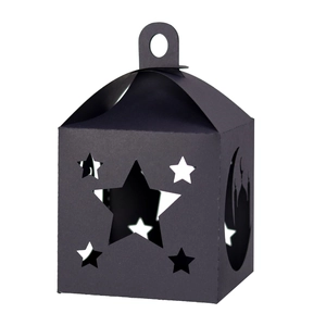 Detailed laser-cut star and moon patterns on a black Ramadan lantern gift box