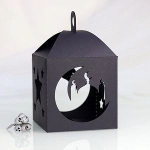 Detail of black laser-cut lantern gift box with moon and mosque silhouette cutout