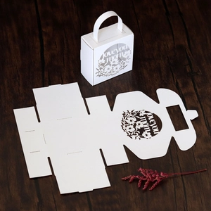 Detail of white laser-cut Mother's Day candy box with 'Love You Mom' floral pattern