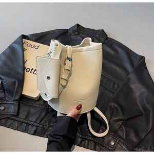 White lychee pattern bucket bag with mini envelope pouch and MUONJIN brand lettering