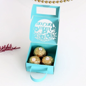 Detailed laser-cut gift box with Love You Mom text and golden chocolate treats