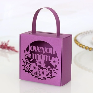 Detail of purple Mother's Day gift box with laser-cut 'Love You Mom' floral pattern