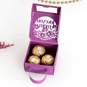 Macro detail of laser-cut floral pattern and Love You Mom text on purple gift box