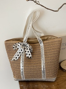 Handmade woven straw tote bag with silver sequins and a black polka dot chiffon bow