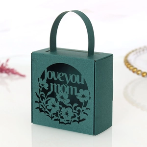 Detailed laser-cut 'Love You Mom' text and floral pattern on dark green gift box