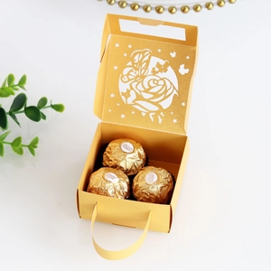 Macro detail of laser-cut butterfly and rose gift box with golden shimmer interior