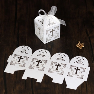 Detailed laser-cut white favor box with God Bless text and elegant ribbon bow