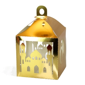 Macro detail of laser-cut gold lantern with mosque pattern for Ramadan decoration