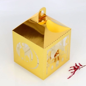 Hollow gold laser-cut gift box with moon and mosque patterns for festive celebrations