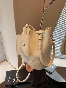 Vintage large capacity cream white bucket bag with pebble leather texture and crossbody strap