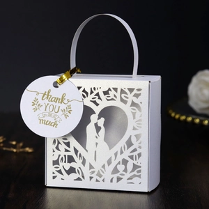 Laser cut wedding candy box with couple silhouette and golden thank you tag
