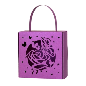 Close-up of laser-cut butterfly and rose pattern on purple hollow gift box with handle