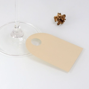 Minimalist beige paper wine glass place cards for weddings with blank DIY surface
