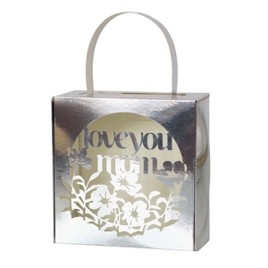 Close-up of silver laser-cut gift box with floral patterns and Love You Mom text