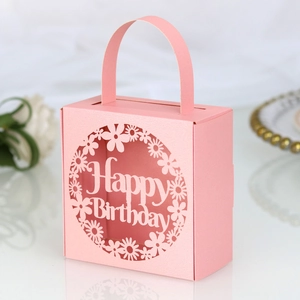 Detailed laser-cut Happy Birthday candy box in pink paper with floral hollow patterns