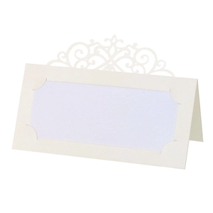 Detailed laser-cut hollow pattern on cream pearlescent paper wedding place card