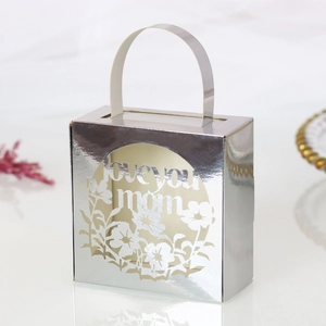 Silver laser-cut Mother's Day gift box with Love You Mom hollow pattern and handle