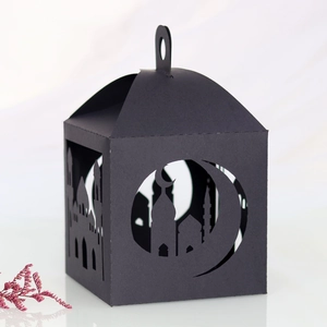 Detailed laser-cut mosque and crescent patterns on a black hollowed paper lantern box
