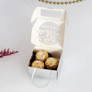 Detail of laser-cut Mother's Day gift box with I Love You Mom text and chocolate capacity