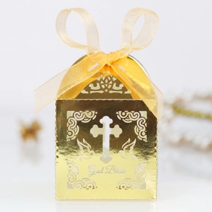 Macro detail of laser-cut cross gift box with God Bless text and golden ribbon