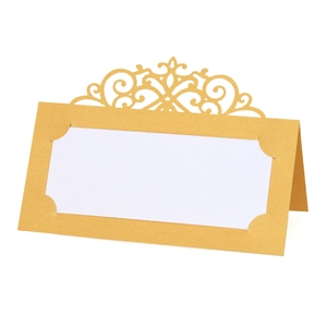 Detailed view of champagne gold laser-cut place card with white writing insert