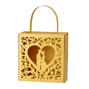 Golden laser-cut wedding favor box with romantic heart and couple silhouette design