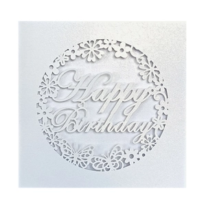 Detailed laser-cut birthday card featuring a white circular floral wreath and butterflies
