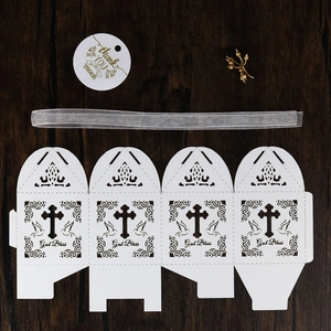 Laser cut favor box with God Bless text, golden thank you tag and ribbon on wood