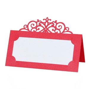 Elegant laser-cut red place card for weddings with white insert and scroll pattern