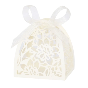 Detail of laser-cut hollow floral pattern on ivory gift box with white silk ribbon bow