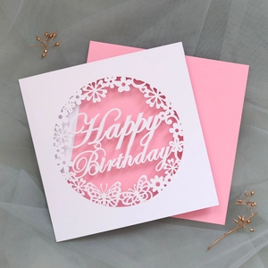Detail of laser-cut Happy Birthday card with intricate butterfly and flower hollow design