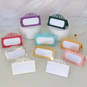 Close-up of laser-cut place cards in 10 colors for elegant wedding table settings