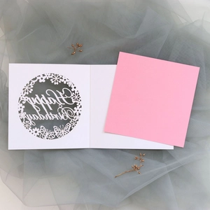 Detailed laser-cut birthday card with hollow butterfly design and pink insert paper