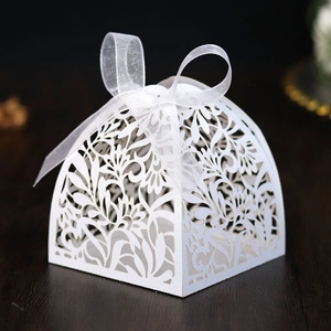 Detailed laser-cut hollow floral pattern on white pearlescent wedding favor gift box