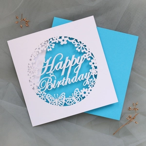 Detailed laser-cut butterfly and floral patterns on Happy Birthday greeting card