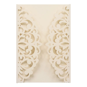 Macro detail of laser-cut floral pattern on pearlescent paper wedding invitation cover