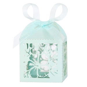 Laser cut gift box with floral patterns and blue ribbon bow for candy packaging