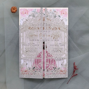 Silver glitter laser-cut gatefold invitation with floral insert and gold lettering