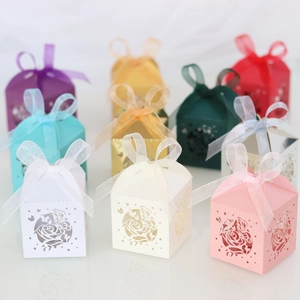 Laser-cut hollow rose candy boxes in nine colors with elegant translucent ribbon bows