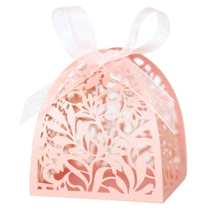 Pink laser-cut candy box with elegant floral hollow patterns and white ribbon bow
