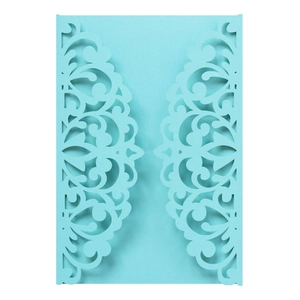 Detailed laser cut floral pattern on light blue pearlescent paper wedding invitation