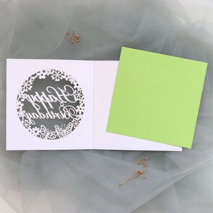 Detail of laser-cut butterfly greeting card with Happy Birthday hollow-out design