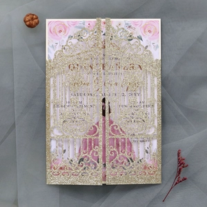 Intricate laser-cut glitter gold Quinceañera invitation with floral rose inner detail