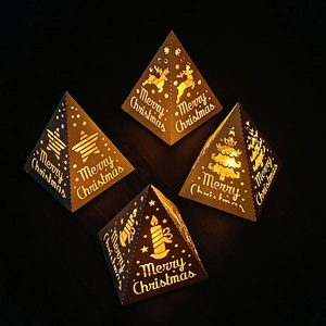 Set of four pyramid Christmas lanterns with reindeer and Merry Christmas cutouts