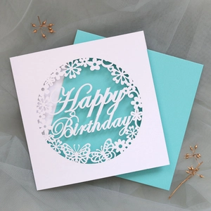 Detail of laser-cut hollow butterfly design and Happy Birthday typography on card set