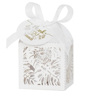 Detail of laser-cut leaf pattern on white gift box with Thank You tag and white satin ribbon