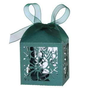 Dark green laser-cut paper candy box with floral patterns and a matching sheer organza ribbon
