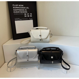 Three mini square flap bags in cream white, silver, and black with metallic locks