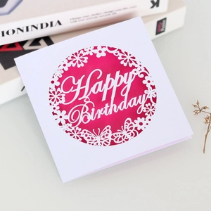 Detailed laser-cut birthday card with hollow butterfly design and red paper lining